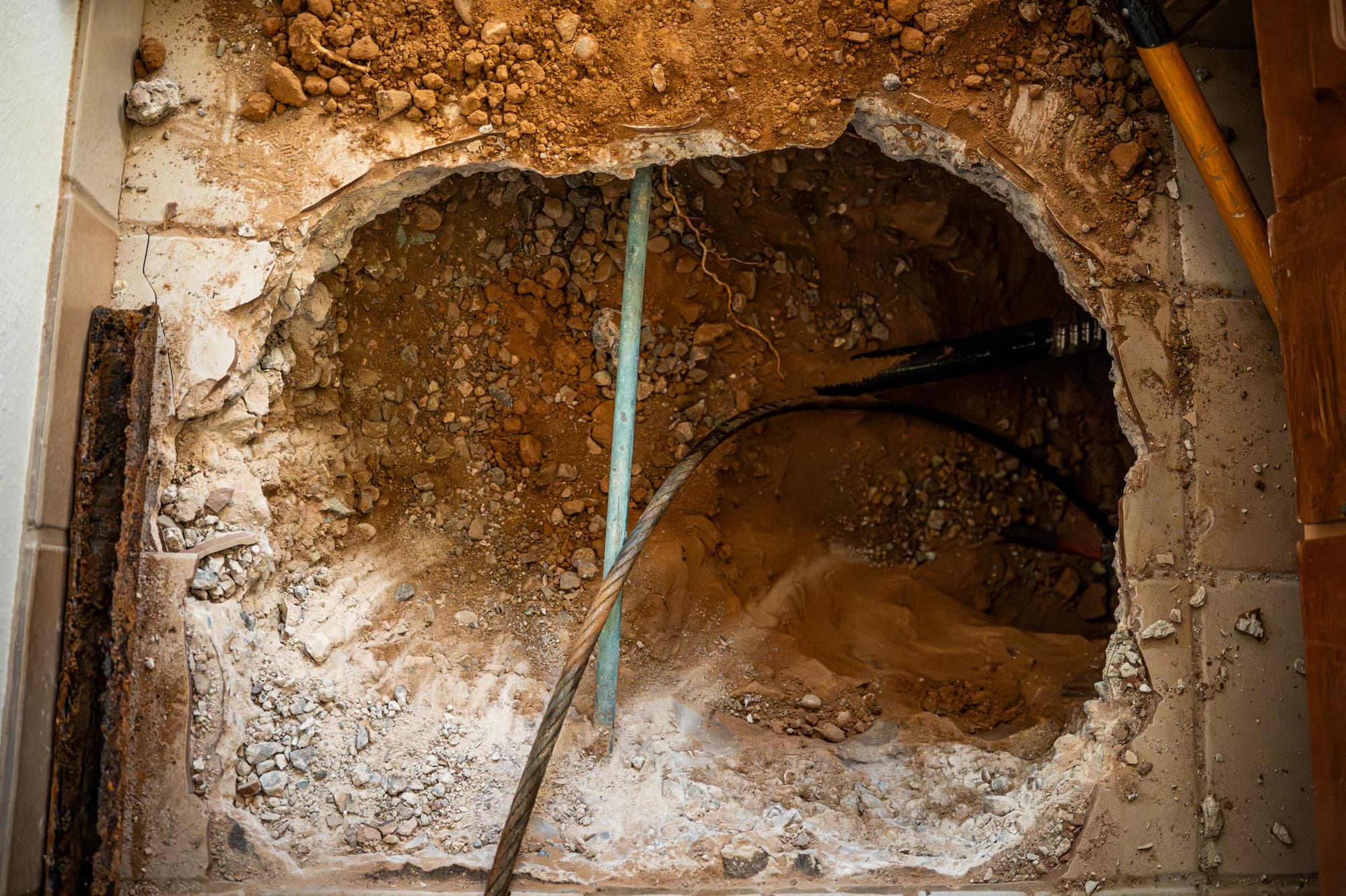 Slab access opened for an emergency underground pipe repair
