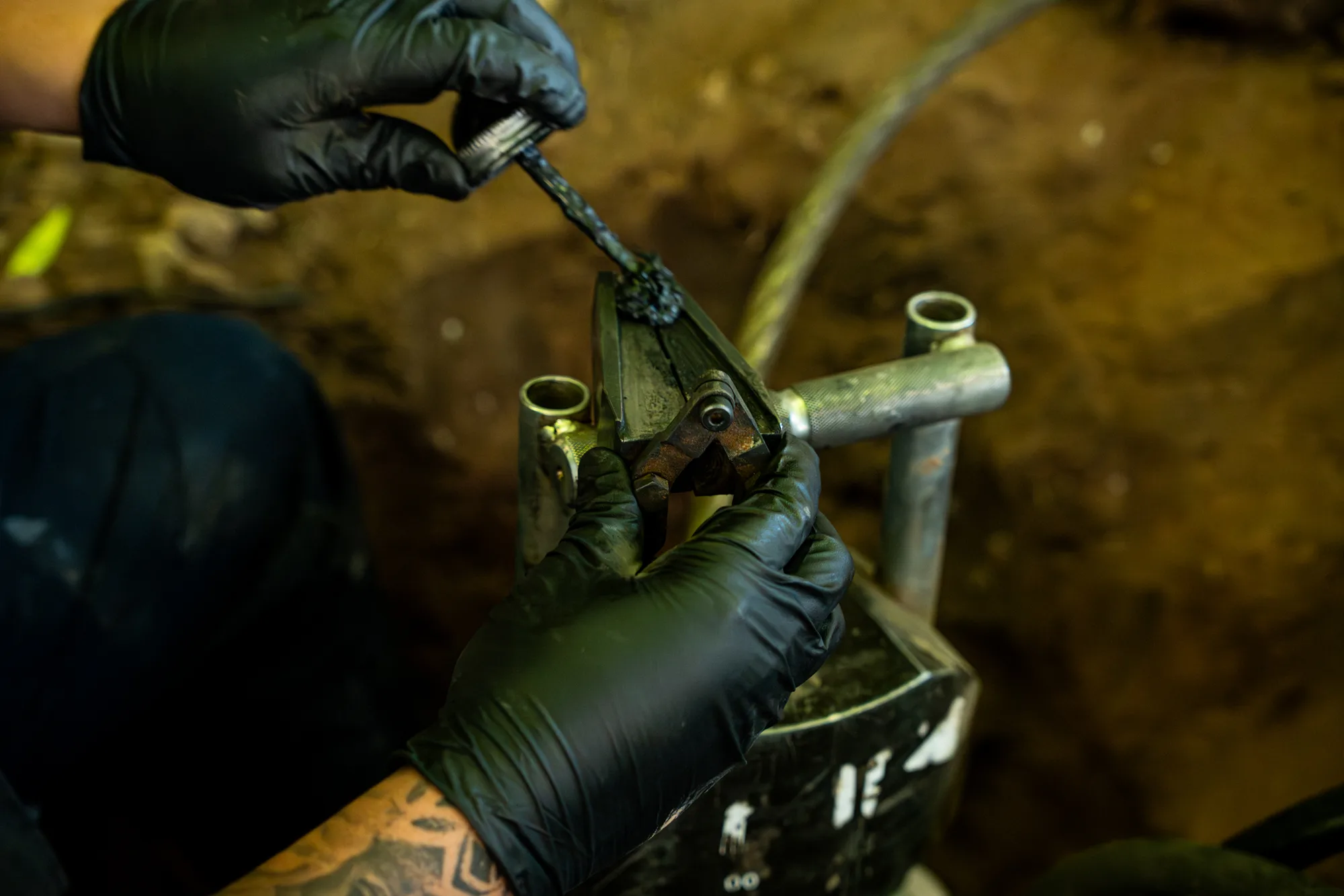 Close-up of professional pipe repair tools on a job site